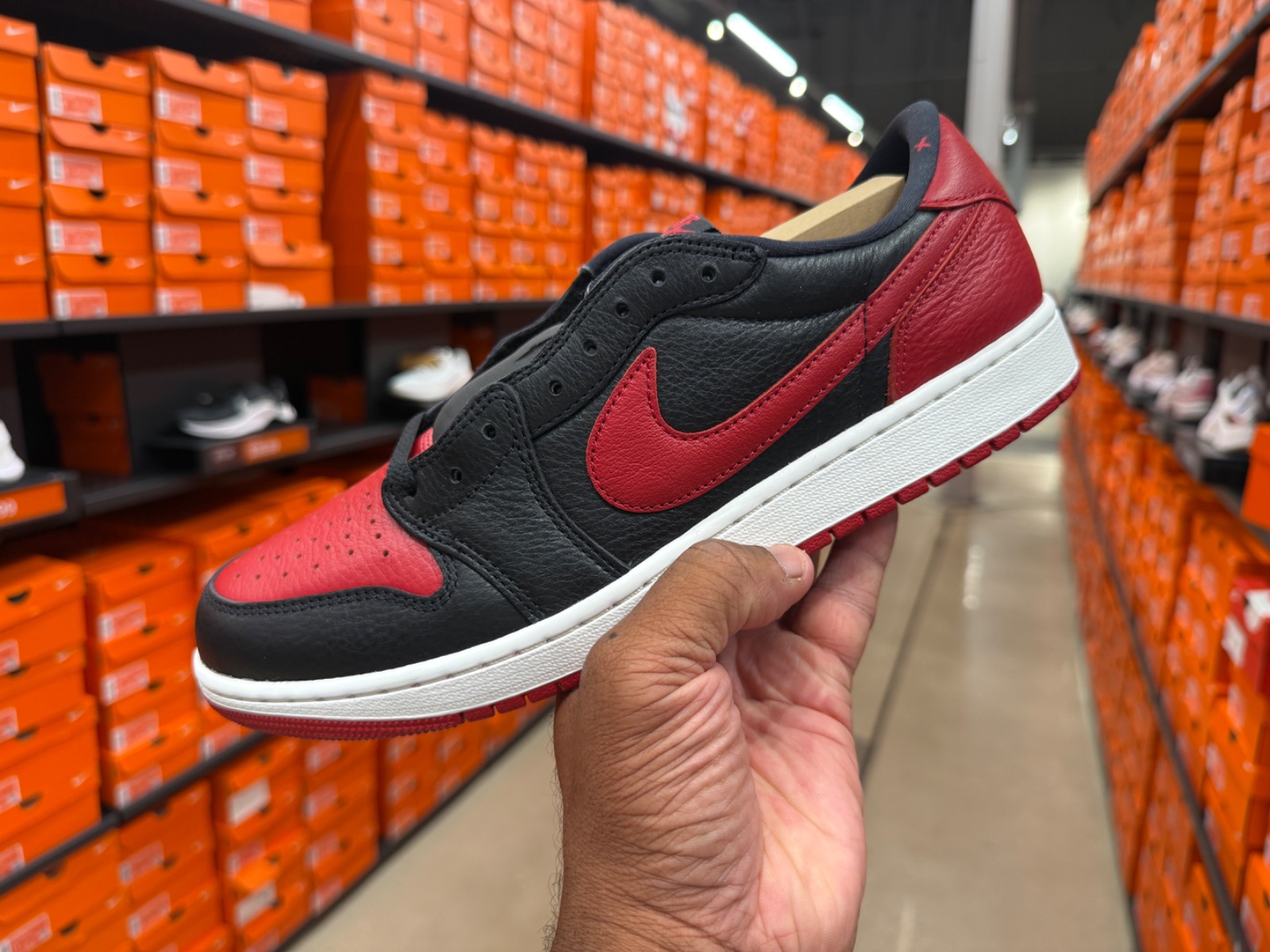 Air Jordan 1 Low Black Varsity Red Hits Outlet at $99.99 at Nike Factory Store — Celebration