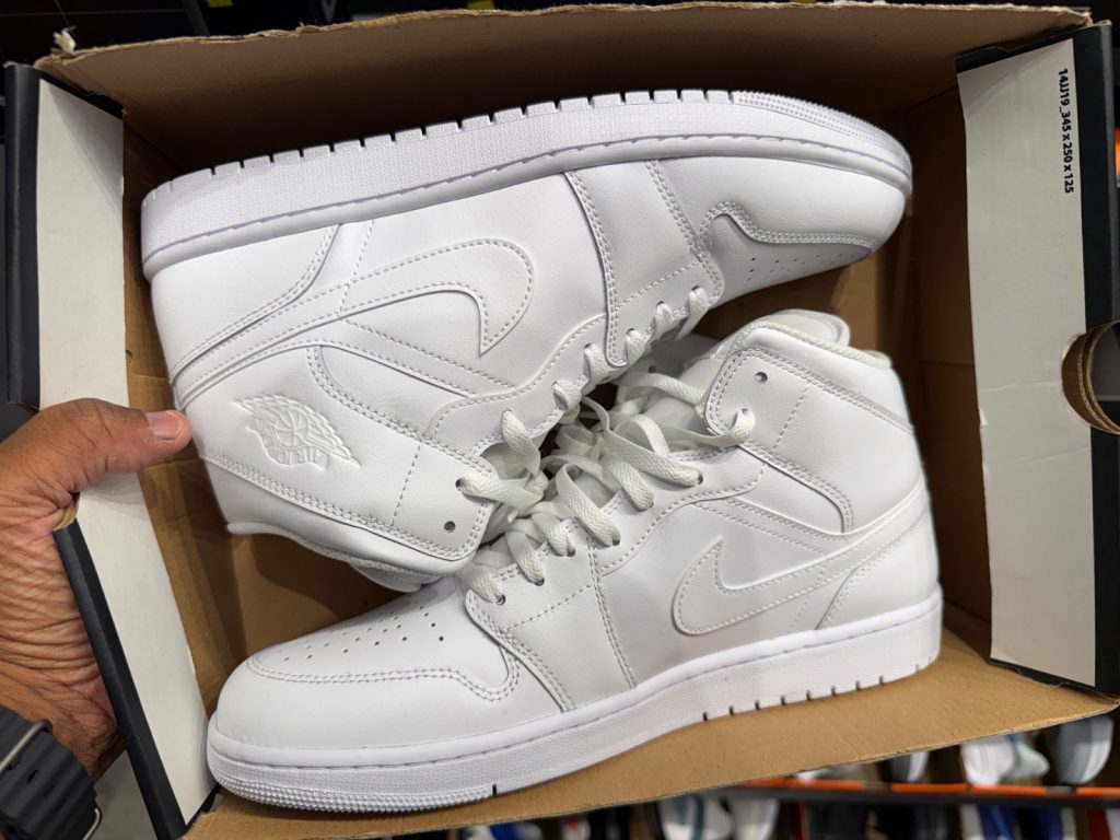 Triple White Jordan 1 Mids Drop to $79.99 at The Loop