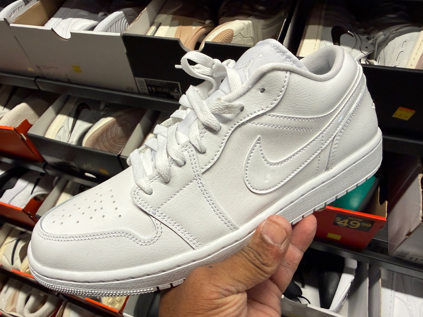 Triple White Jordan 1 Low Hits Marketplace for $69.99! at Nike Clearance Store — Marketplace Plaza